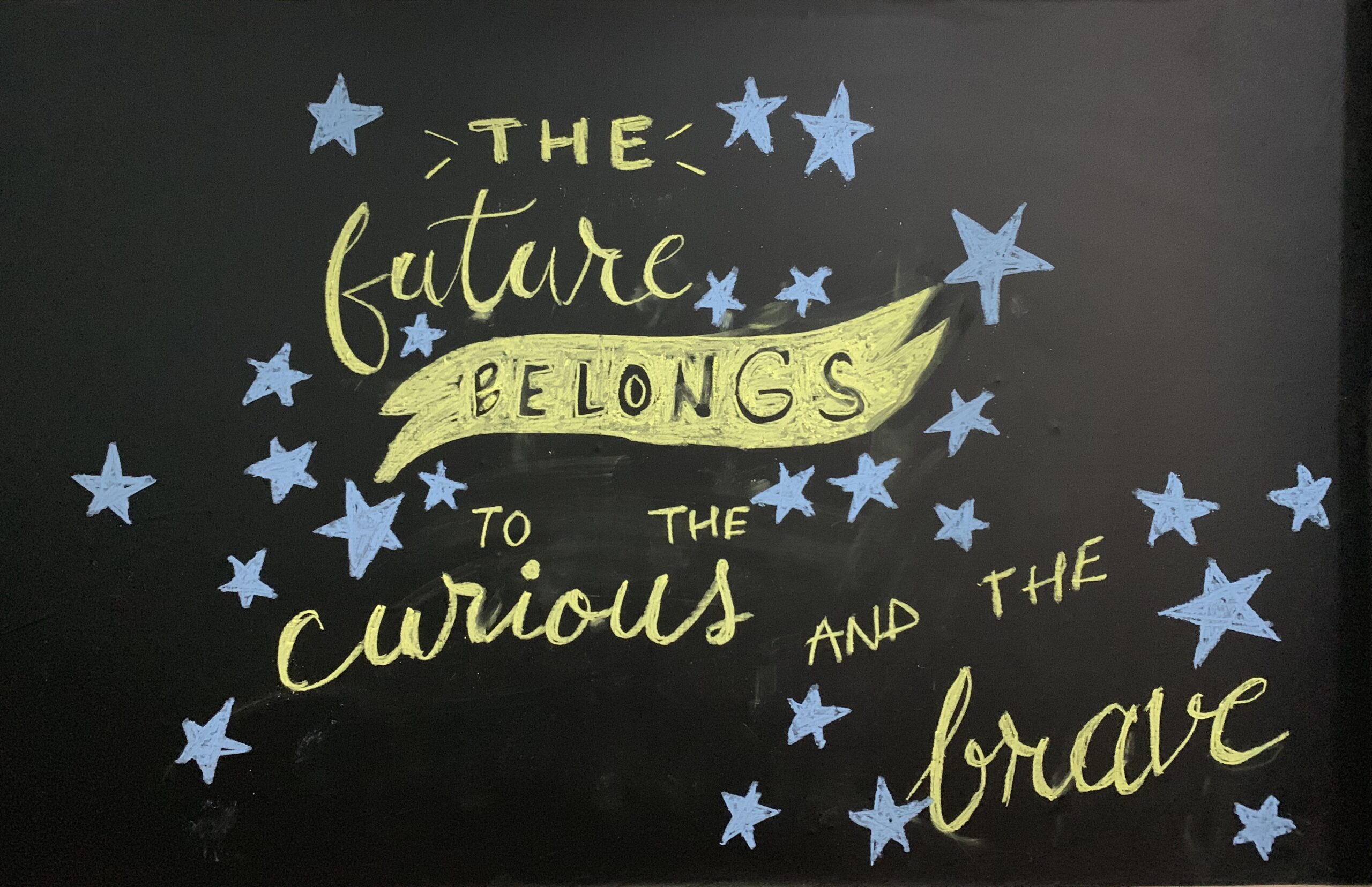A quote illustrated on a blackboard
