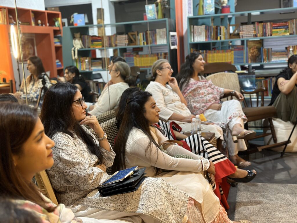 The audience laughing along with a story at a Qissa Kahaani over Biryani event.