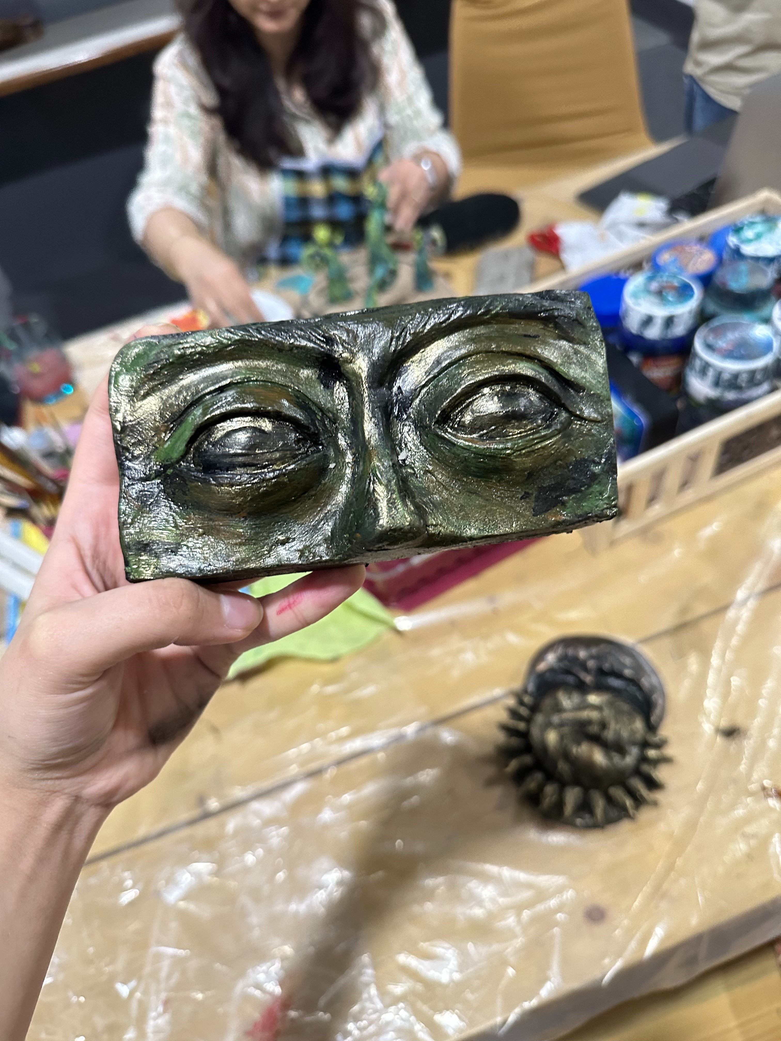 Photo of a painted sculpture made by a participant of the Clay Sculpting Workshop.